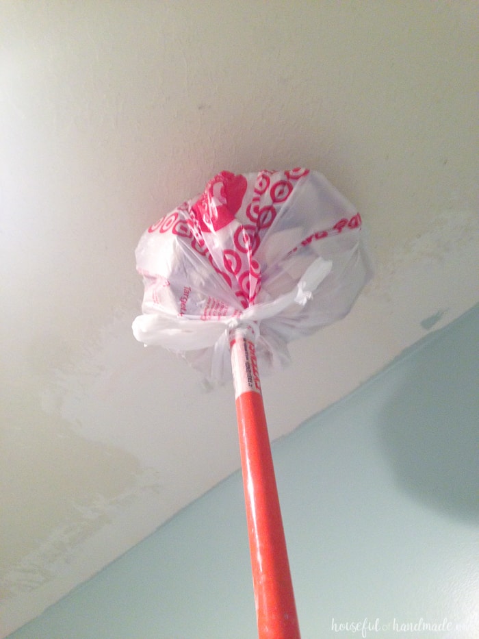 paint stick with plastic bag painting ceiling