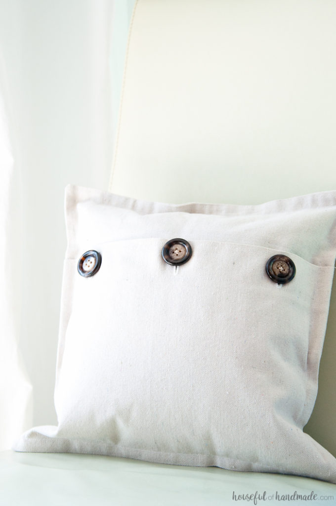 I love using drop cloth for farmhouse style pillows. This easy drop cloth pillow cover tutorial is the best way to add lots of throw pillows to your rustic decor. | Housefulofhandmade.com