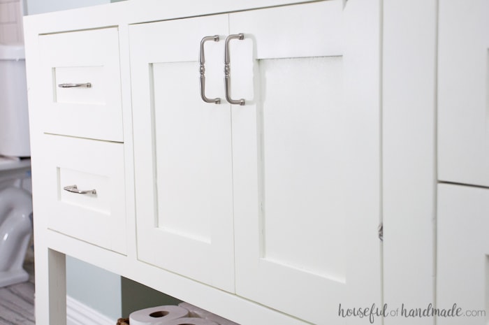 Close up of the cabinet doors and drawers with brushed nickel pulls on the top of the DIY Bathroom vanity. 