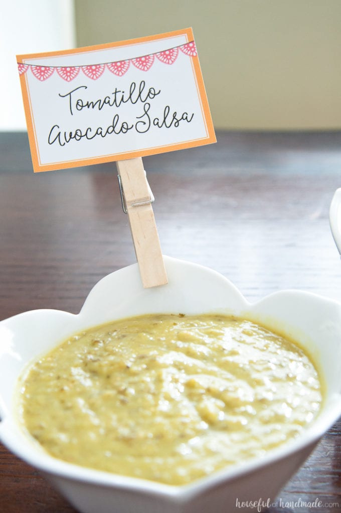 custom sign labeling tomatillo avocado salsa on a table at a Salsa & Margaritas Adult Birthday Party