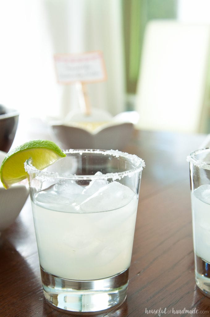 spicy jalepeno margarita with lime on a table with salsa at a Salsa & Margaritas Adult Birthday Party