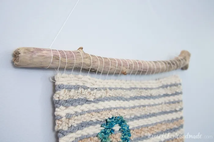 Create beautiful textured art for your walls with a DIY weaving. I decided to try out weaving for the first time and am sharing what I learned while making a Woven Anchor Wall Hanging. It was so much fun, I am already planning on a second project. | Housefulofhandmade.com