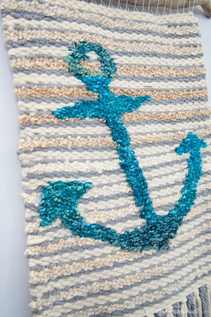 Create beautiful textured art for your walls with a DIY weaving. I decided to try out weaving for the first time and am sharing what I learned while making a Woven Anchor Wall Hanging. It was so much fun, I am already planning on a second project. | Housefulofhandmade.com