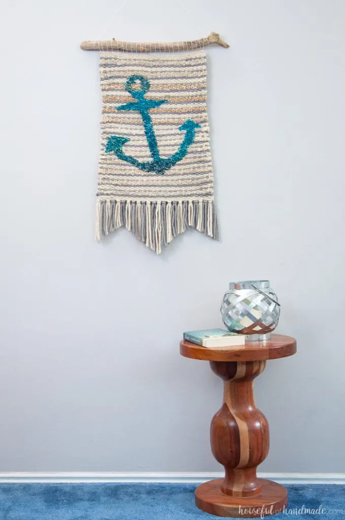 Create beautiful textured art for your walls with a DIY weaving. I decided to try out weaving for the first time and am sharing what I learned while making a Woven Anchor Wall Hanging. It was so much fun, I am already planning on a second project. | Housefulofhandmade.com