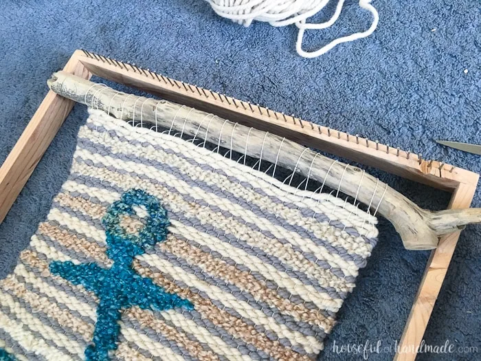 Create beautiful textured art for your walls with a DIY weaving. I decided to try out weaving for the first time and am sharing what I learned while making a Woven Anchor Wall Hanging. It was so much fun, I am already planning on a second project. | Housefulofhandmade.com