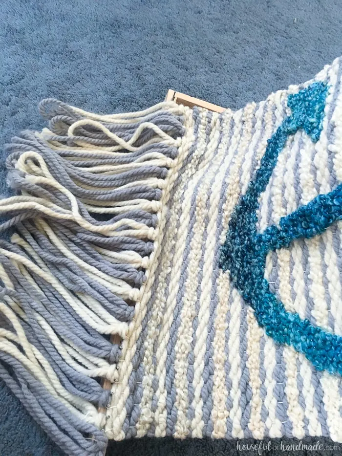 Create beautiful textured art for your walls with a DIY weaving. I decided to try out weaving for the first time and am sharing what I learned while making a Woven Anchor Wall Hanging. It was so much fun, I am already planning on a second project. | Housefulofhandmade.com