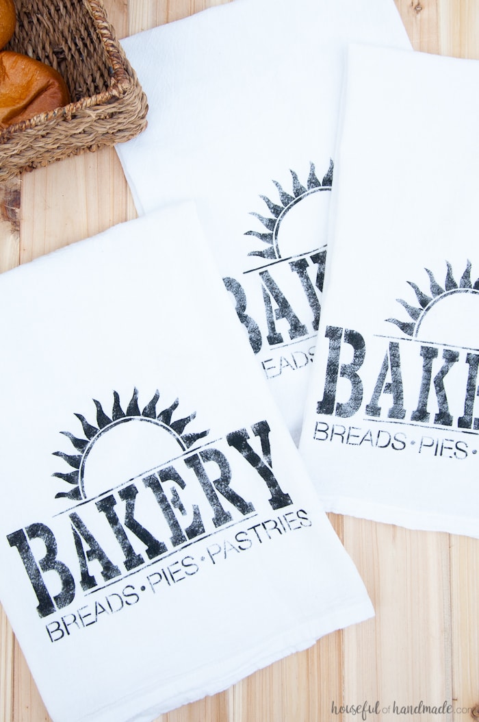  I want to make a bunch of these tea towels for gifts! These easy to make DIY bakery tea towels are a great way to add vintage charm to your kitchen or to give as gifts. Learn how to make a plastic stencil with your Silhouette to paint on inexpensive store bought flour sack towels. | Housefulofhandmade.com
