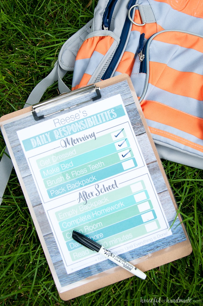 free printable daily chore charts shown next to back bag with a pen on grass