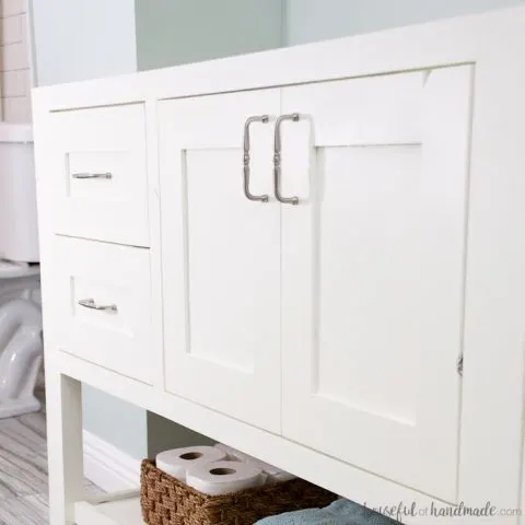 White painted bathroom vanity during a DIY bathroom remodel.