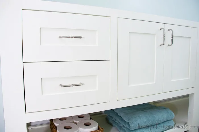 White mission style vanity with smooth professional paint finish on it. 