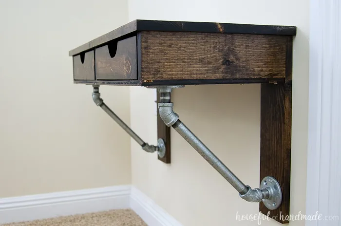 Create the perfect homework space with this easy to build desk. This easy rustic industrial wall-mounted desk can be added in any small space. Get the free build plans today! | Housefulofhandmade.com