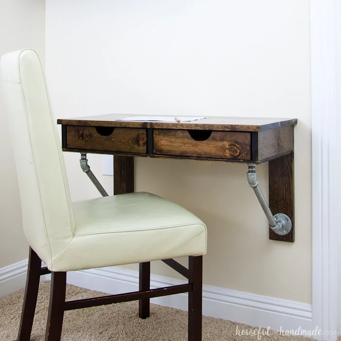 Use these amazing DIYs to Organize your home this year. Create the perfect homework space with this easy to build desk. This easy rustic industrial wall-mounted desk can be added in any small space. Get the free build plans today! | Housefulofhandmade.com