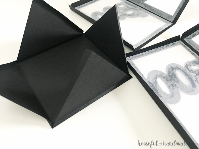 These are the perfect decorations for a Halloween buffet table or in a dark window. Make these DIY paper Halloween lanterns easily with the free digital cut file or PDF to decorate your home this Halloween. | Housefulofhandmade.com