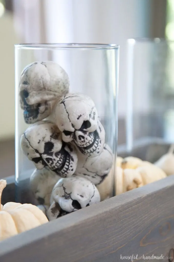 This is the perfect combination of spooky and farmhouse decor. Decorate your dining room table with this easy DIY Halloween centerpiece. Includes a tutorial to make a wooden trough box in minutes. | Housefulofhandmade.com