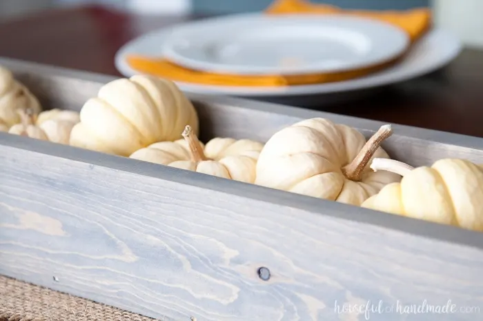 Make Thanksgiving extra festive with these easy Thanksgiving place cards that can be filled with treats for an easy appetizer. These paper pumpkin boxes are easy to make and will leave your guests feeling extra special this holiday season. | Housefulofhandmade.com