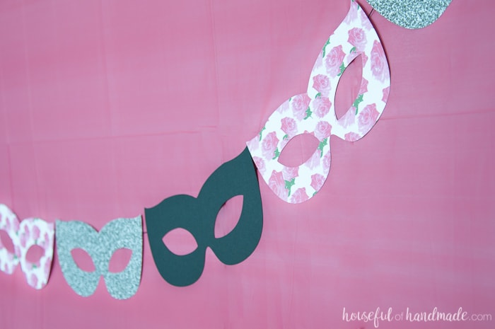 close up image of mask banner designed for a masquerade ball themed birthday