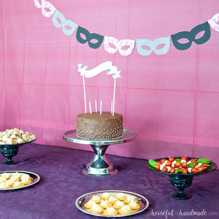 food displayed on a table masquerade ball themed birthday