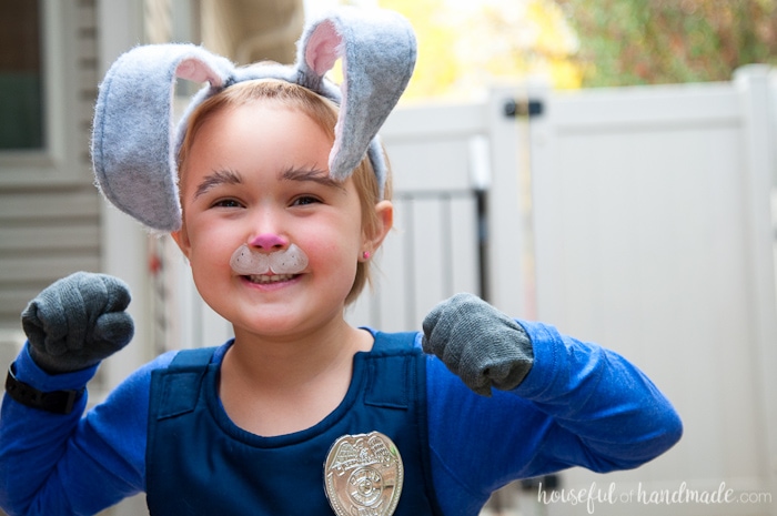 Officer Judy Hopps ready for duty! This is the perfect halloween costume for a strong little (or big) girl. See how easy it is to make an Office Judy Hopps Halloween costume, complete with Fox Away! | Housefulofhandmade.com