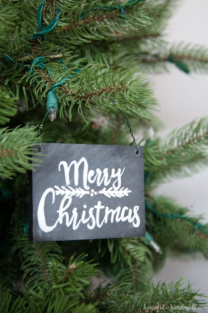 These Christmas ornaments are perfect for my rustic decor! Learn how to make these DIY chalkboard sign ornaments with just a few simple steps. They are perfect for a farmhouse style Christmas or to gift to friends and family. | Housefulofhandmade.com