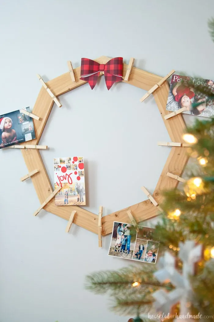 DIY wood Christmas card wreath displayed with cards