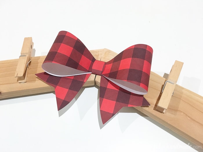 buffalo check bow shown on diy christmas card wreath holder