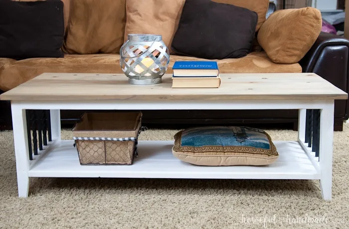 I love this simple, rustic open shelf coffee table. Create the perfect place to relax with this easy to build farmhouse coffee table. Get the free build plans today. | Housefulofhandmade.com