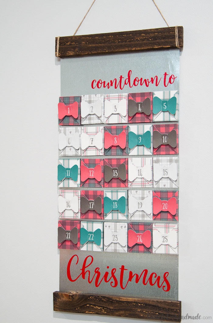 I absolutely love this farmhouse style advent calendar! If you love buffalo check and tartan plaid this is the advent calendar for you. Make 25 plaid boxes, sealed with a bow, to hold a surprise or activity for every day in December until Christmas. Get all the details for how to make a farmhouse plaid Christmas advent calendar today! | Housefulofhandmade.com