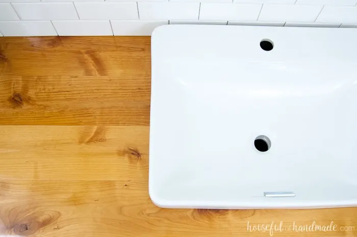 Top down view of the wood vanity top in the master bathroom.