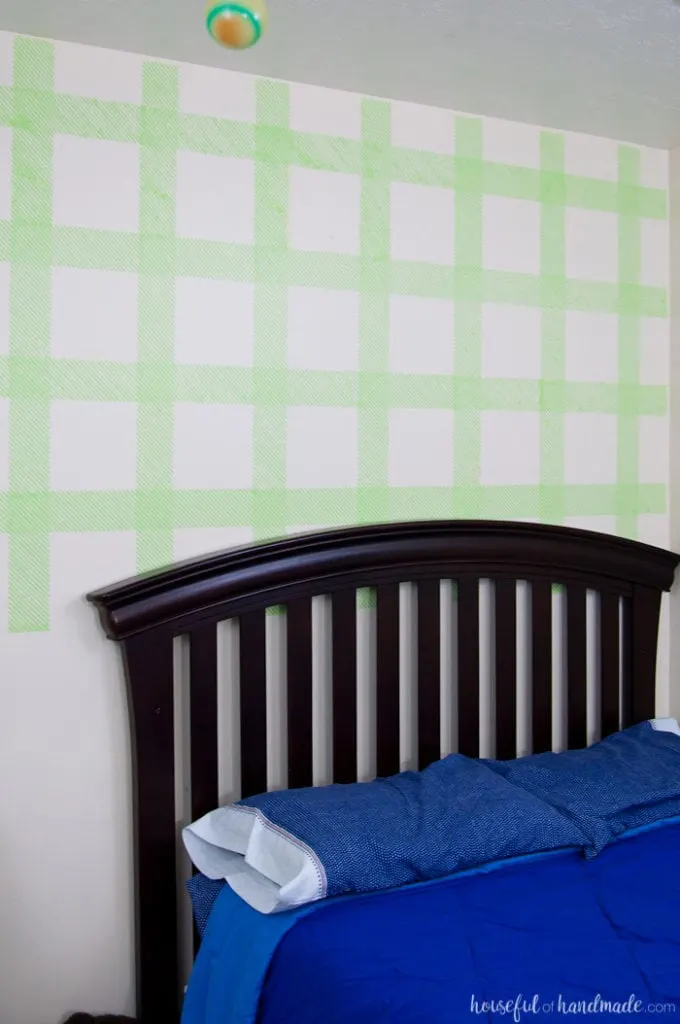 Create an awesome feature wall for your boy's room with this DIY plaid wall. Learn how to make your own stencil and paint it with all these great stencil tips & tricks. | Housefulofhandmade.com