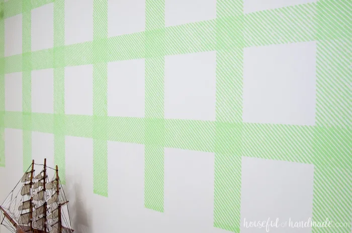 Create an awesome feature wall for your boy's room with this DIY plaid wall. Learn how to make your own stencil and paint it with all these great stencil tips & tricks. | Housefulofhandmade.com