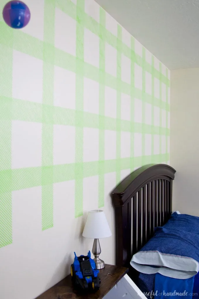 Create an awesome feature wall for your boy's room with this DIY plaid wall. Learn how to make your own stencil and paint it with all these great stencil tips & tricks. | Housefulofhandmade.com