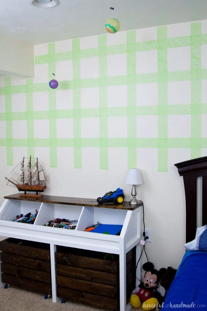 Create an awesome feature wall for your boy's room with this DIY plaid wall. Learn how to make your own stencil and paint it with all these great stencil tips & tricks. | Housefulofhandmade.com