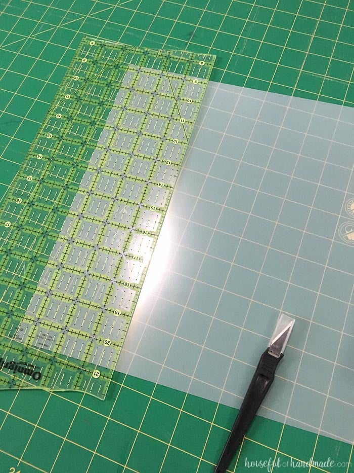 plexiglass and ruler with xacto knife