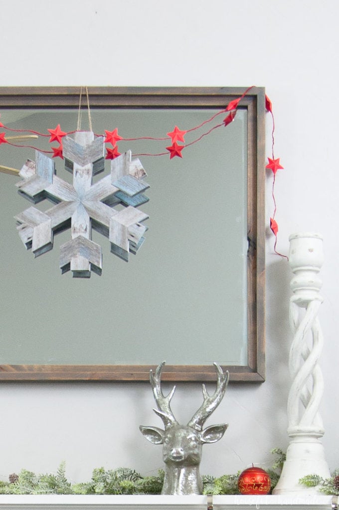 If you don't like power tools you can still get these perfect wood snowflakes for your winter decor. This easy faux wooden snowflake decor is made out of paper but looks just like real wood. Make a bunch to decorate your Christmas tree or winter mantle. | Housefulofhandmade.com