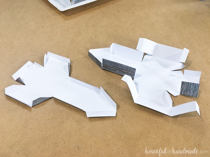 If you don't like power tools you can still get these perfect wood snowflakes for your winter decor. This easy faux wooden snowflake decor is made out of paper but looks just like real wood. Make a bunch to decorate your Christmas tree or winter mantle. | Housefulofhandmade.com