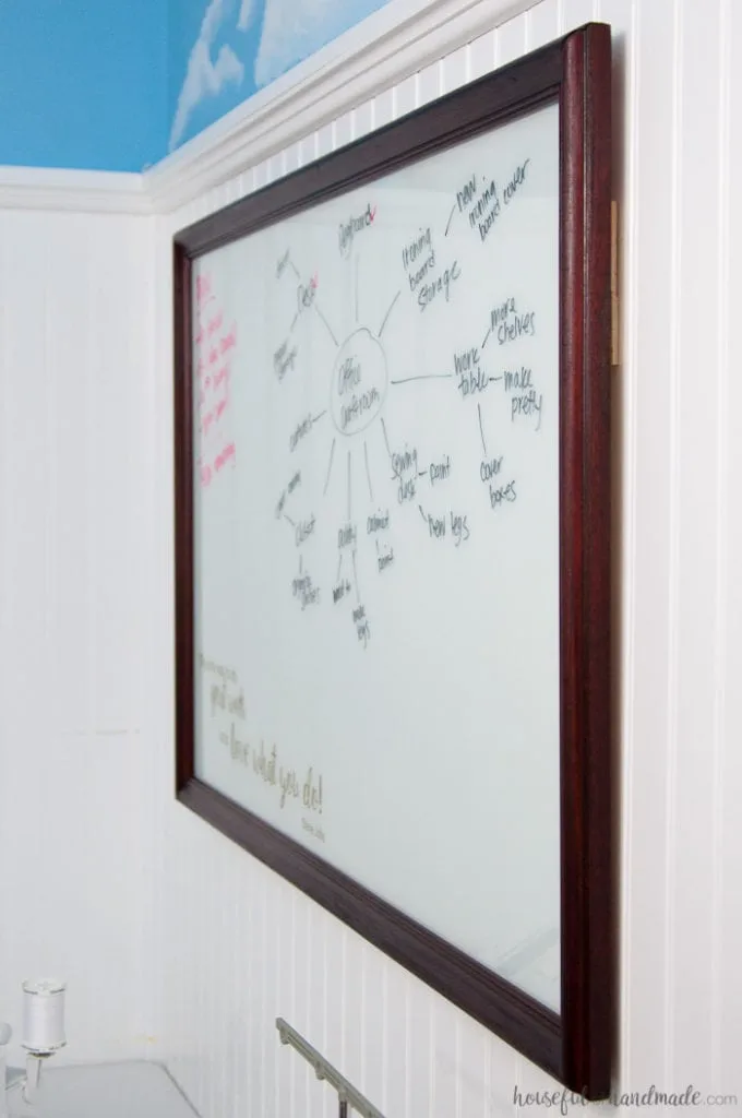 Turn an old thrift store picture into a DIY idea board for your office. The perfect place to sketch out all your creative thoughts. | Housefulofhandmade.com | Custom Whiteboard | Upcycled Picture Frame | Things to do with Picture Frames | Transform Thift Store Picture Frame | Office Organization | Office Productivity Ideas | Budget Makeover | $100 Room Challenge