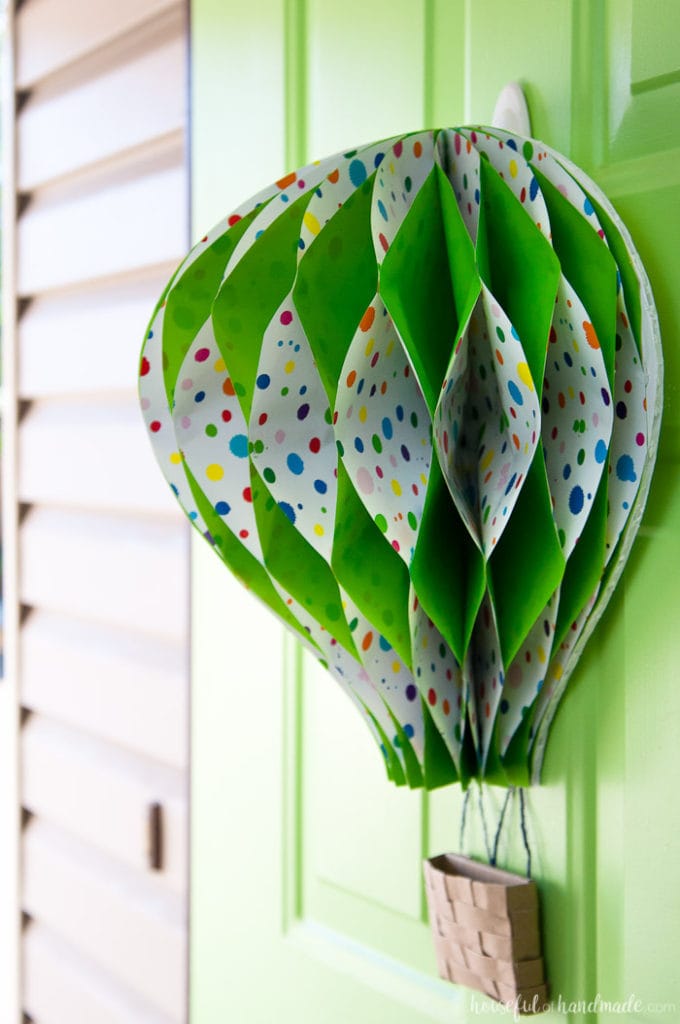 Make a paper hot air balloon spring wreath to brighten up your front door this spring! Housefulofhandmade.com | Unique wreath ideas | Spring Wreath | Summer Wreath | Paper Crafting | DIY Hot Air Balloon | Paper Decor | DIY Wreath