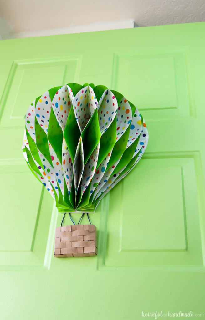 Make a paper hot air balloon spring wreath to brighten up your front door this spring! Housefulofhandmade.com | Unique wreath ideas | Spring Wreath | Summer Wreath | Paper Crafting | DIY Hot Air Balloon | Paper Decor | DIY Wreath