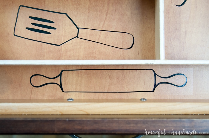 close up of vinyl kitchen utensil drawings in a drawer