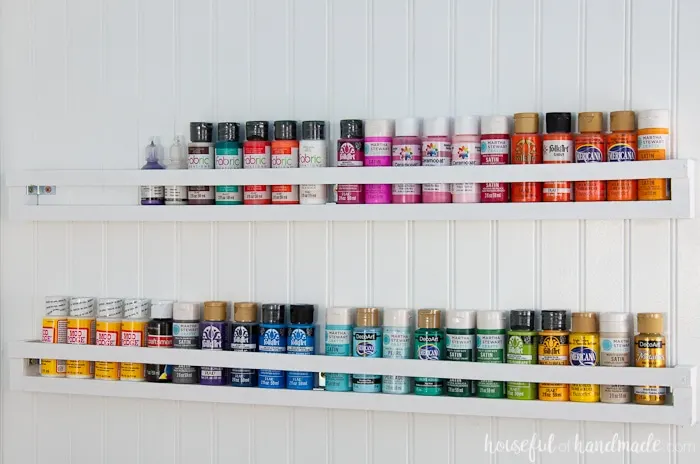 Create the perfect DIY paint storage from scraps or cheap wood. The paint storage shelves can even be hung in closets or behind doors to free up even more space. Housefulofhandamde.com | $100 Room Challenge | Spray Paint Storage | Craft Paint Storage | Craft Room Organization | Scrap Wood Build Plans | Free Build Plans | DIY Storage Solutions | Craft Room Makeover | Office Makeover