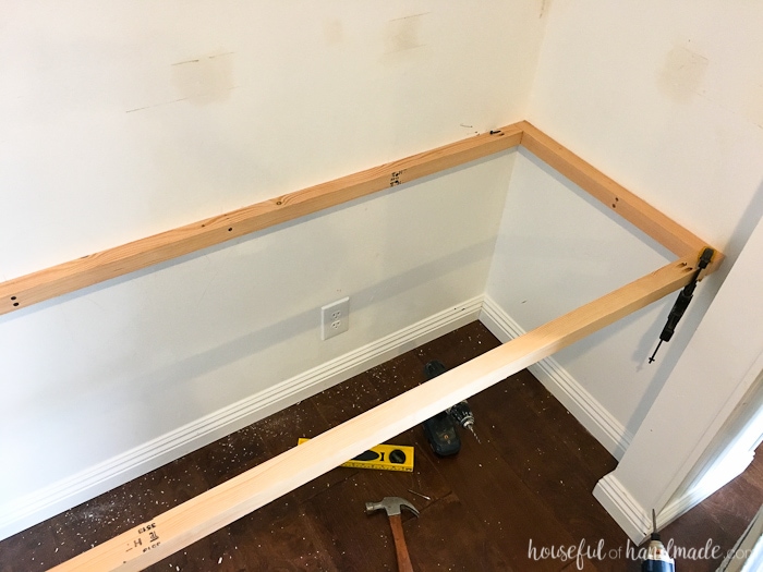 desk frame shown attached to closet with 2x2 boards and pocket hole screwed to the ends. 