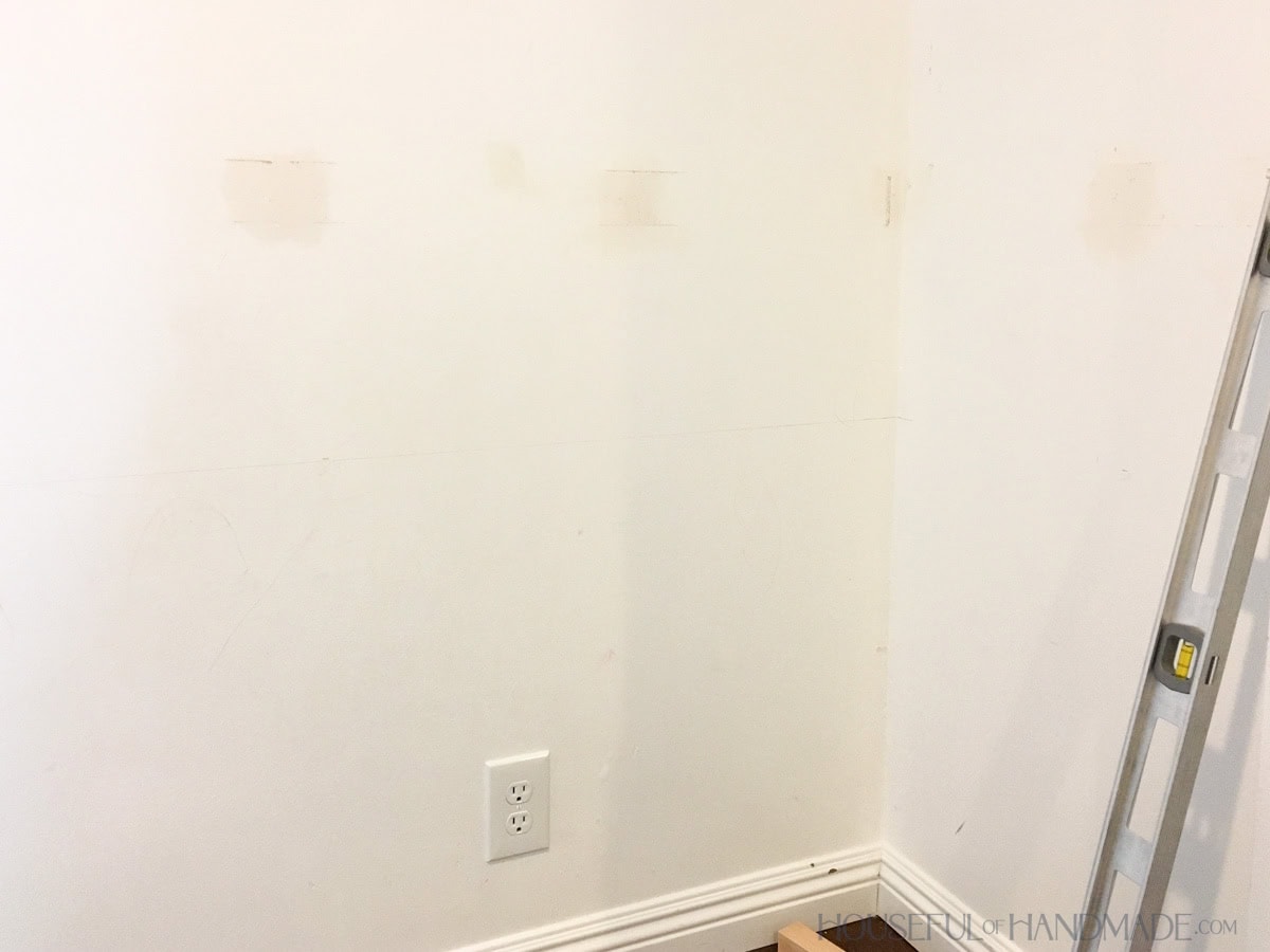 Inside of empty closet with walls patched but not painted.