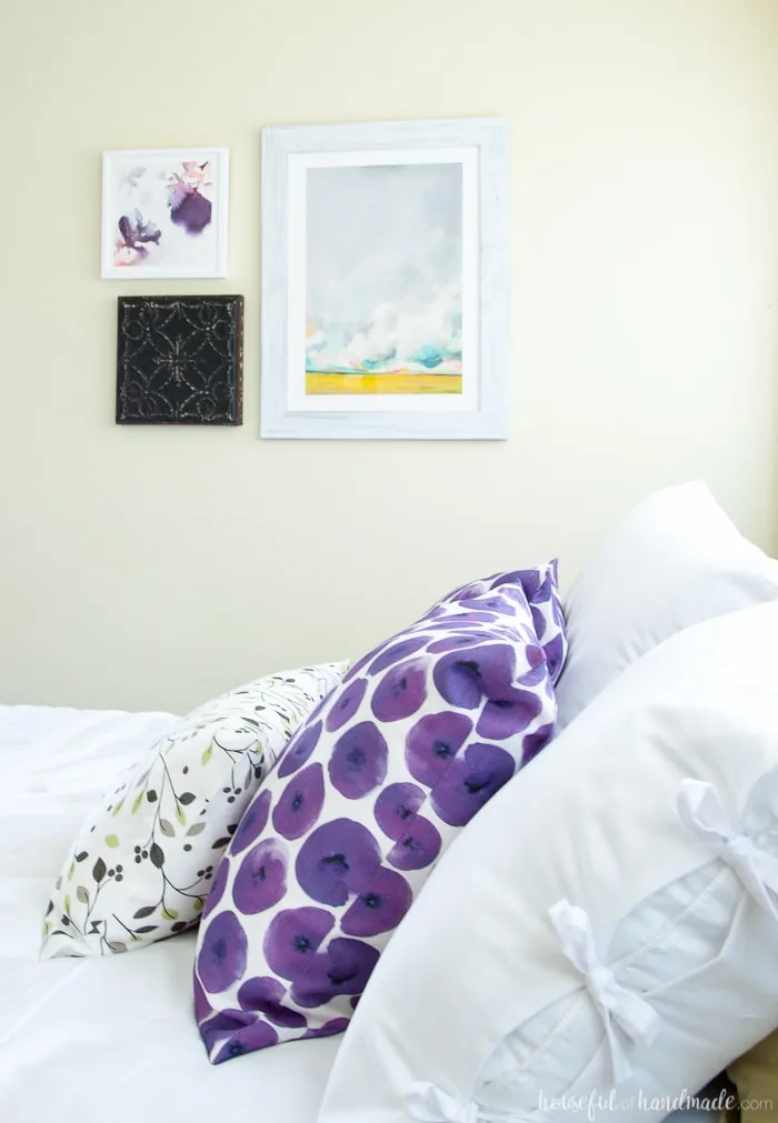 See how easy it is to complete a Master Bedroom Makeover in a weekend. A handful of simple projects can make your bedroom look bigger and brighter. Housefulofhandmade.com | Weekend Makeover | Bedroom Refresh | White Curtains | White bedding | Bed pillows | Bedroom Art | Roman Shades