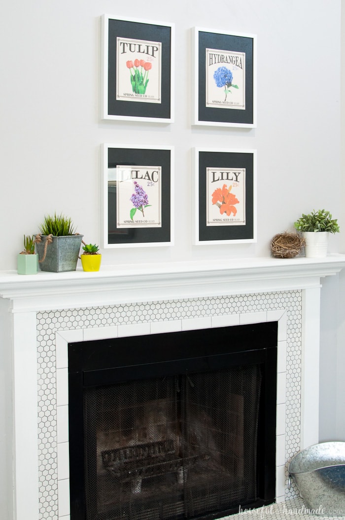 Create the perfect Spring Mantel with flowers and greenery. It's so easy to achieve this statement mantel with free printables and a some faux plants. Housefulofhandmade.com | Spring Mantel | Free Printable | Vintage Seed Packets | Flower Themed Mantel | Spring Mantel Ideas | Easy Mantel 
