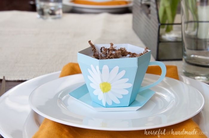 Decorate your home for spring with lots of flowers and color. This easy Spring Tablescape features adorable floral print paper tea cups and lots of sunshine. Housefulofhandmade.com | Spring Tablescape | Easter Tablescape | Mother's Day Brunch | Paper Tea Cups | 3D Tea Cup | Easter Decor | Spring Decor | Farmhouse Decor 