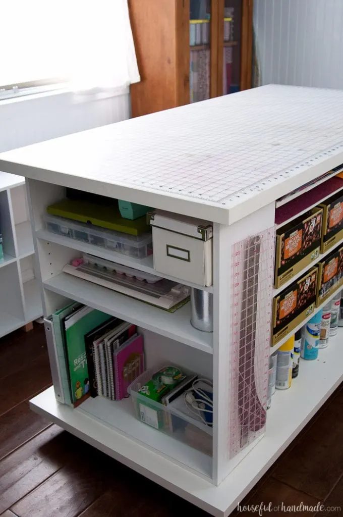 Don't throw out those old cheap bookcases from your college days, upcycle them into the perfect work station. Create this amazing upcycled bookcase rolling work table for your craft room or office. | Housefulofhandmade.com || Craft Table | Rolling Work Table | Upcycled Bookcase | Craft Room Storage | Free Build Plans