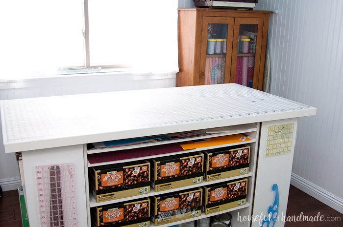 Don't throw out those old cheap bookcases from your college days, upcycle them into the perfect work station. Create this amazing upcycled bookcase rolling work table for your craft room or office. | Housefulofhandmade.com || Craft Table | Rolling Work Table | Upcycled Bookcase | Craft Room Storage | Free Build Plans