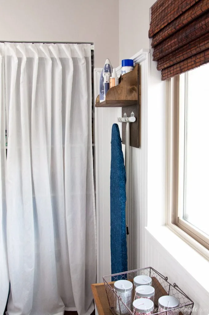 Create the perfect place to store your iron and supplies. This easy DIY Iron Holder with Ironing Board Storage is a quick build that will keep your laundry room or craft room organized. Free build plans on Housefulofhandmade.com | Laundry Room Storage Ideas | Ironing Board Hanger | Iron Shelf | Things to Build with Scraps | $100 Room Challenge