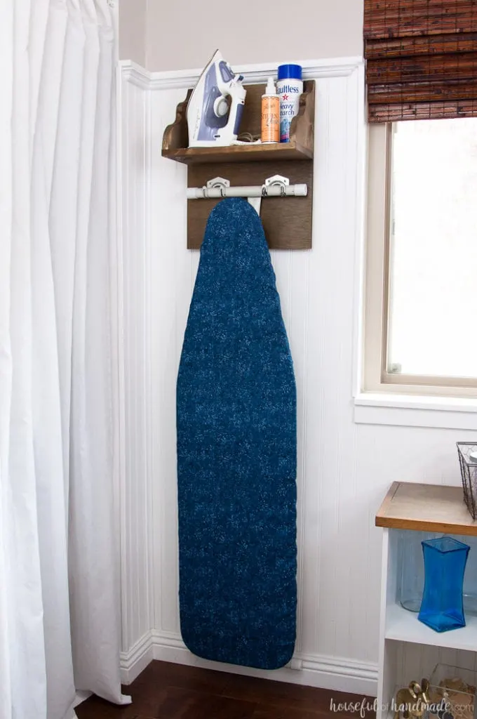 Create the perfect place to store your iron and supplies. This easy DIY Iron Holder with Ironing Board Storage is a quick build that will keep your laundry room or craft room organized. Free build plans on Housefulofhandmade.com | Laundry Room Storage Ideas | Ironing Board Hanger | Iron Shelf | Things to Build with Scraps | $100 Room Challenge