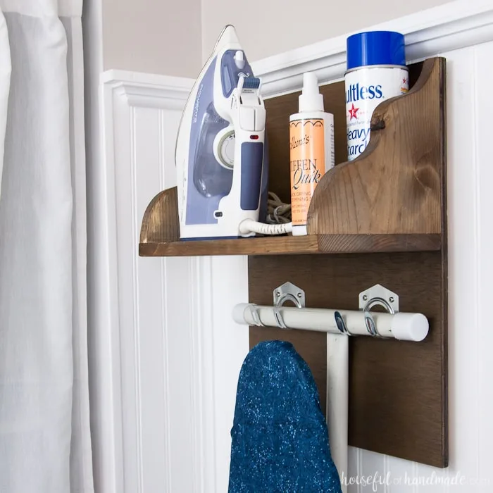 Create the perfect place to store your iron and supplies. This easy DIY Iron Holder with Ironing Board Storage is a quick build that will keep your laundry room or craft room organized. Free build plans on Housefulofhandmade.com | Laundry Room Storage Ideas | Ironing Board Hanger | Iron Shelf | Things to Build with Scraps | $100 Room Challenge